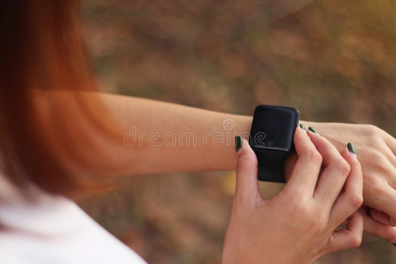 Young Girl Using His Smart Watch App. Closeup Hands Stock Photo