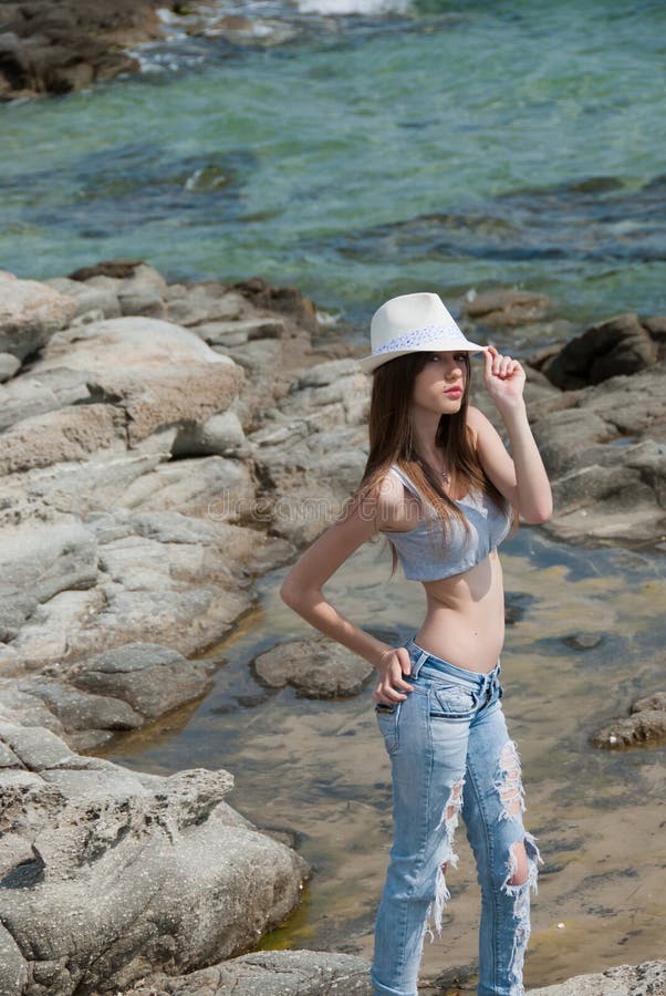 Photo of a Woman Wearing a White Crop Top and Denim Shorts · Free