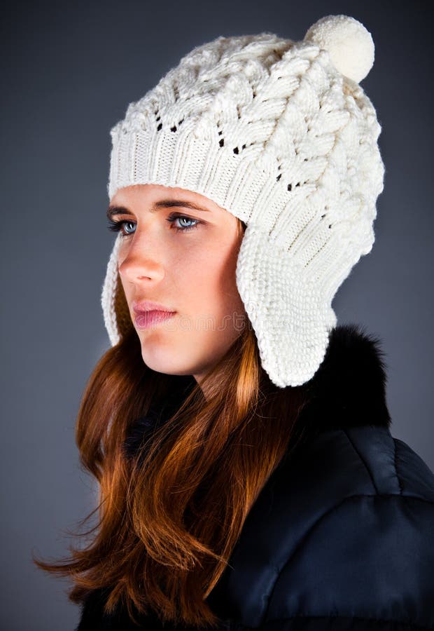 Young Girl in a Winter Cap on the Dark Stock Photo - Image of female ...