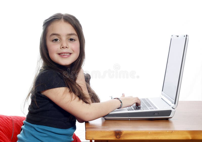 Young girl working on laptop stock photography