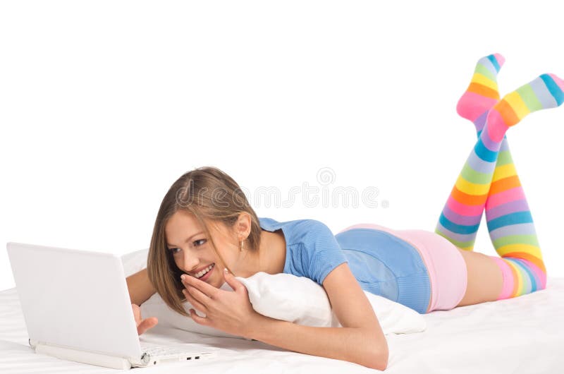 Young girl working with laptop at home