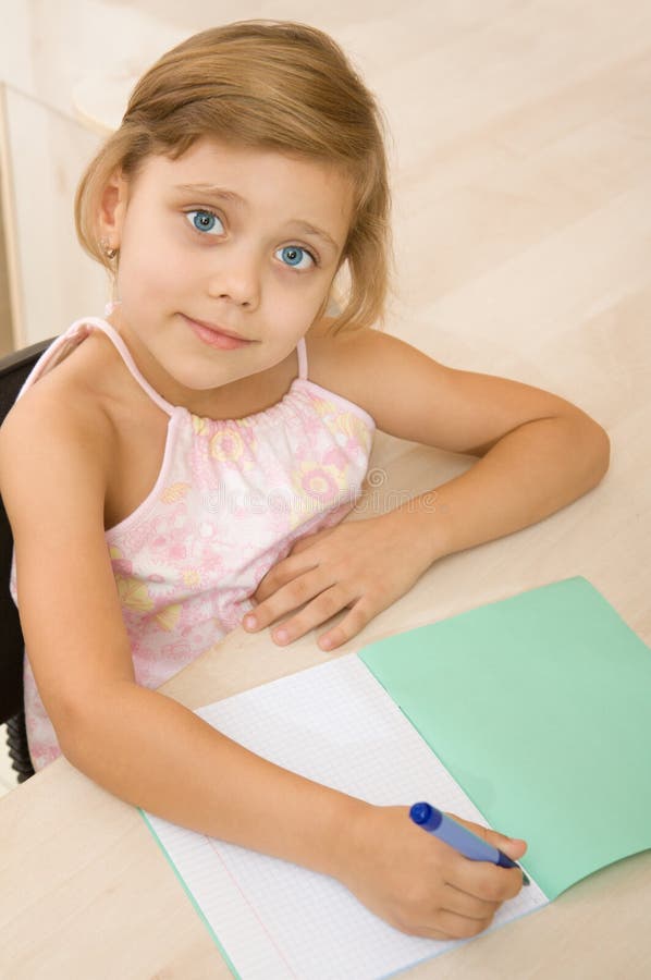 Young girl writing in a notebook