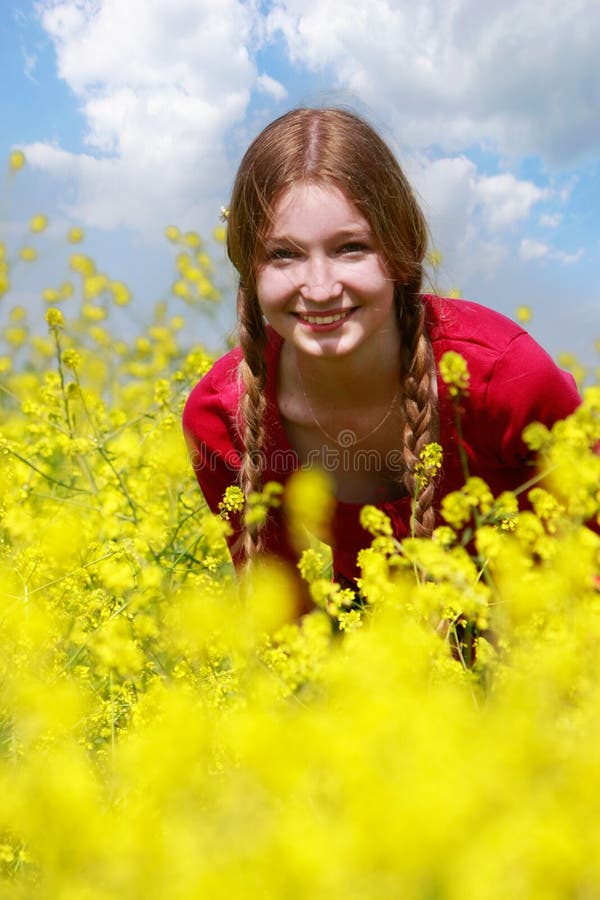 Young girl in yellow flowers