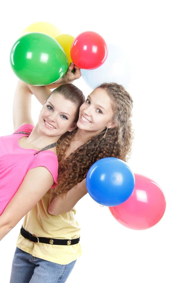 Young girls with balloons over white