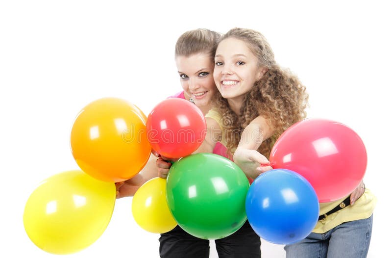 Young girls with balloons over white