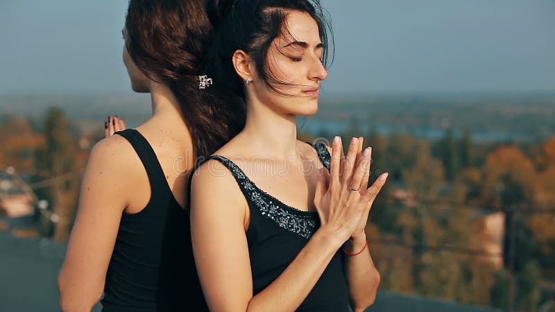 Young girls doing yoga pise namaste closeup, pranamasana