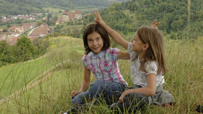 Young girls fooling around, Copsa Mare, Romania