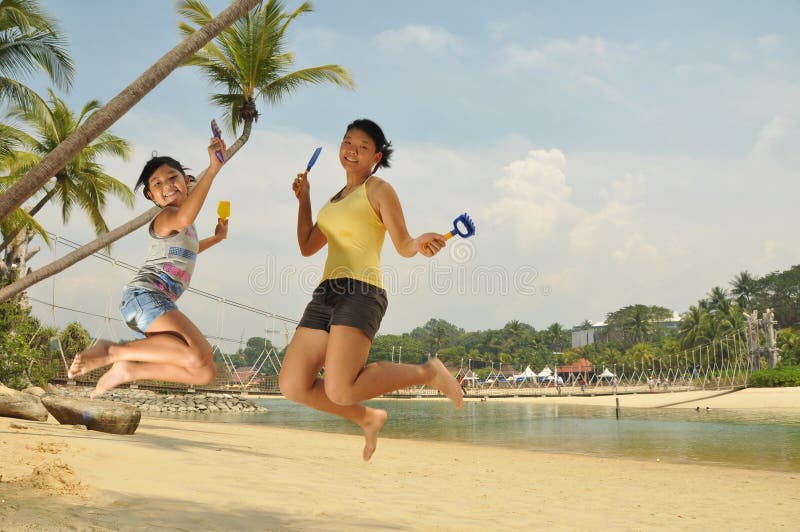 Young Girls Having Fun At The Beach