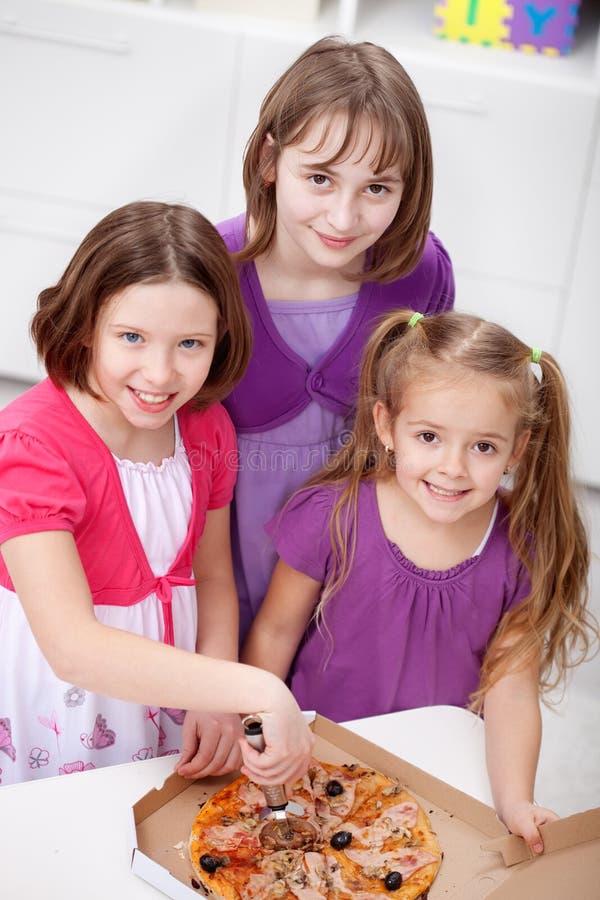 Young girls having pizza