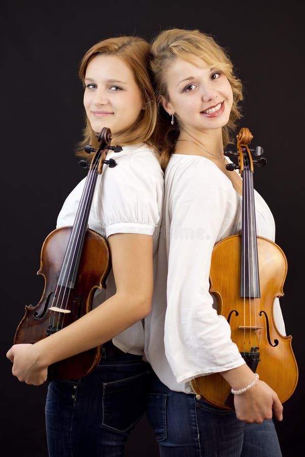 Young girls with violin and viola stock images