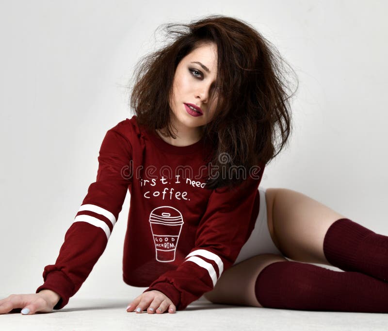 Young glamour brunette woman posing in burgundy blouse and underwear