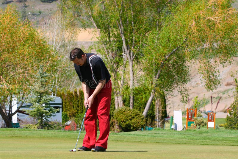 Young male golfer playing a round of golf. Day game drive stock images, royalty-free photos and pictures