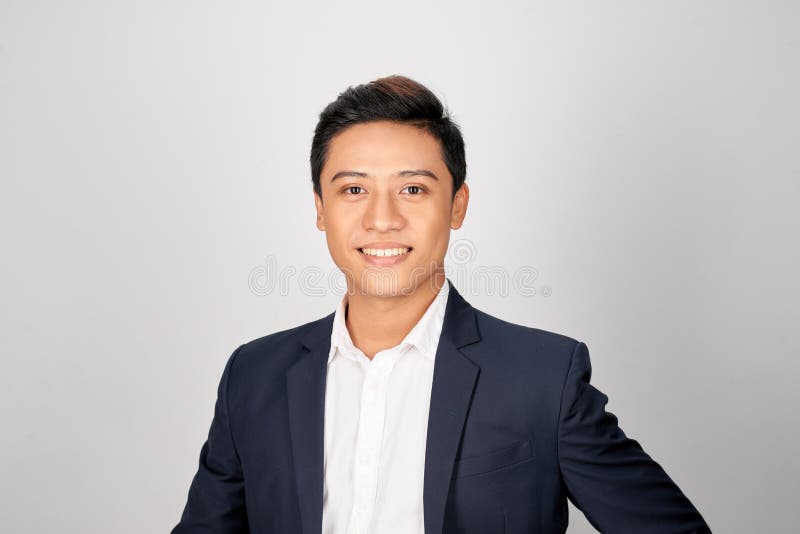 Young good looking asian business man on a white background isolated stock images Young good looking asian business man on a white background isolated stock images
