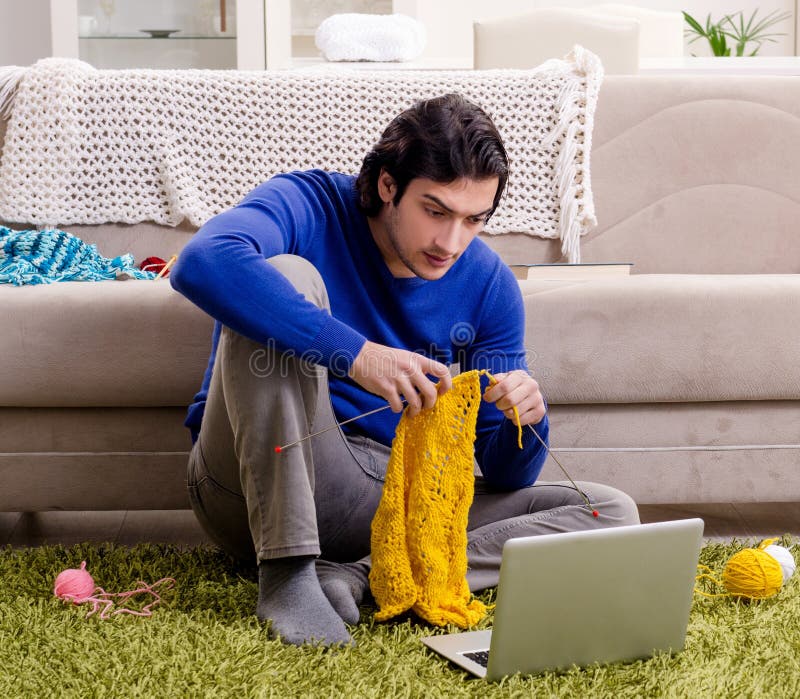 Young Good Looking Man Knitting at
