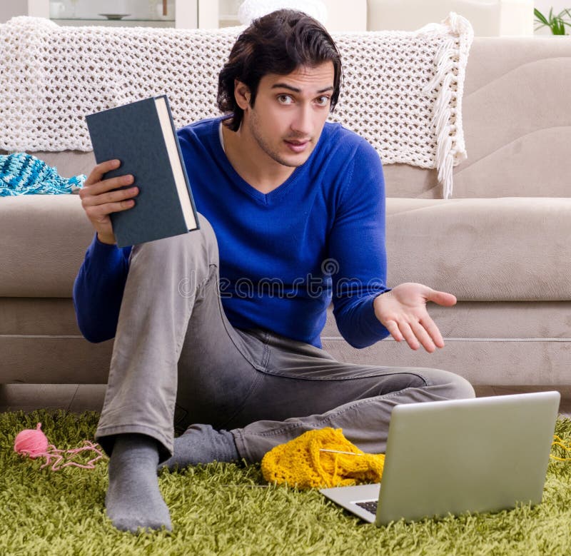 Young Good Looking Man Knitting at