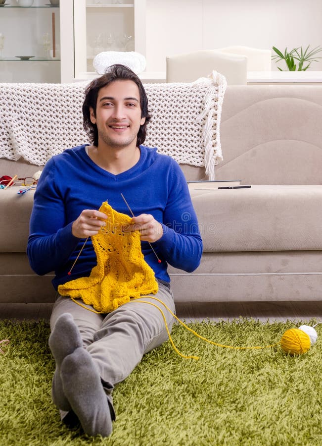 Young Good Looking Man Knitting at