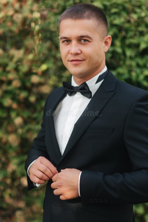 Young Groom in Suit Otside. Handsome Man in Black Suit Stock Photo ...