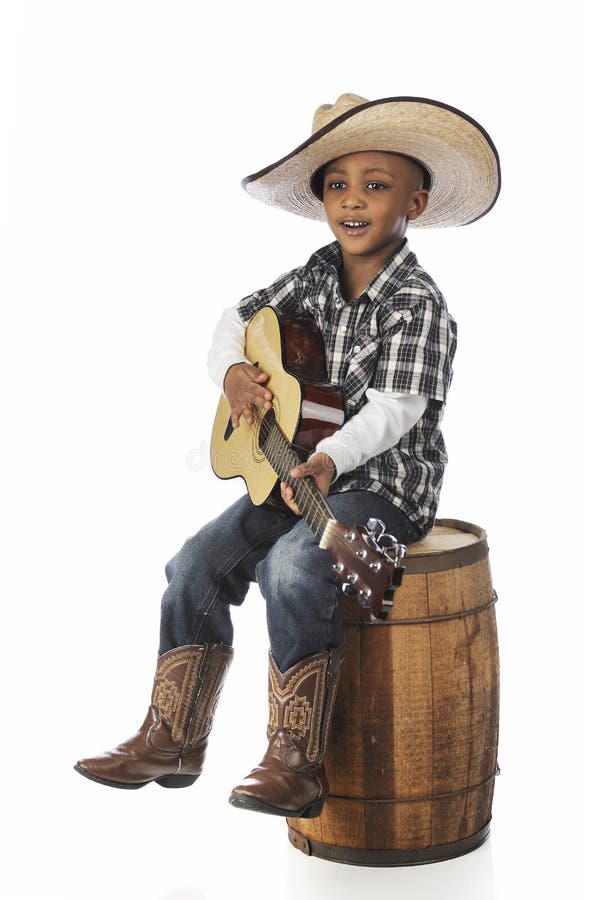 Young Guitar-Playing Cowboy royalty free stock photos Young Guitar-Playing Cowboy royalty free stock photos