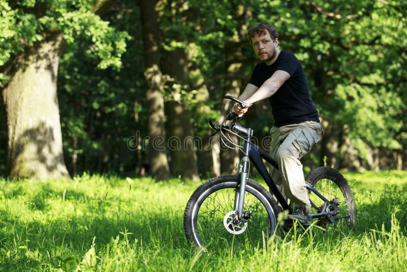 Young guy on bike stock photo. Image of stop, shirt 137411692