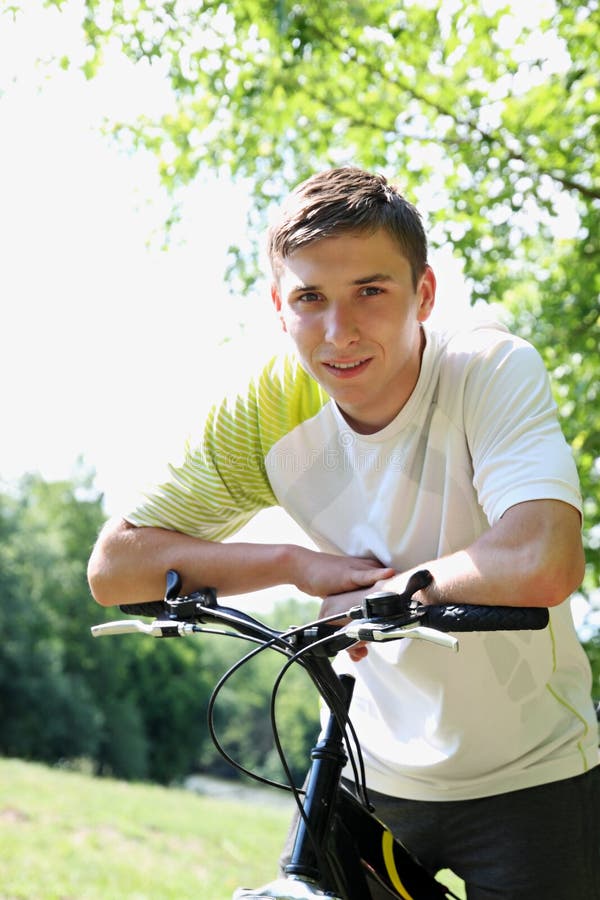 Young guy on a bike stock image. Image of leisure, forest - Young Guy Bike Portrait FrienDly 31523339