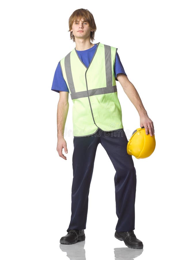 Young Guy Builder or Trainee in Work Clothes with Protective Helmet in