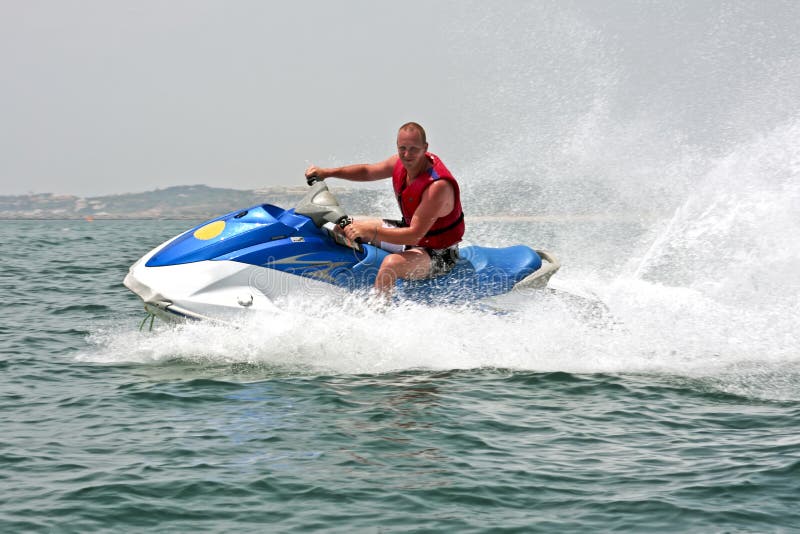 Young Guy Cruising on a Jet Ski Stock Image Image of surf, ride 9909119