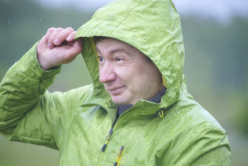 A Young Guy in a Raincoat with a Hood Stock Photo Image of tourism