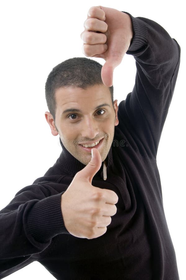Young guy with thumbs up and down