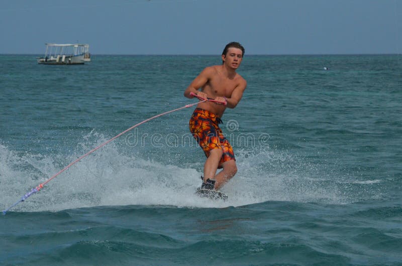 Young Man Wakeboarding Off the Coast of Palm Beach Stock Image Image of muscles, wakeboard