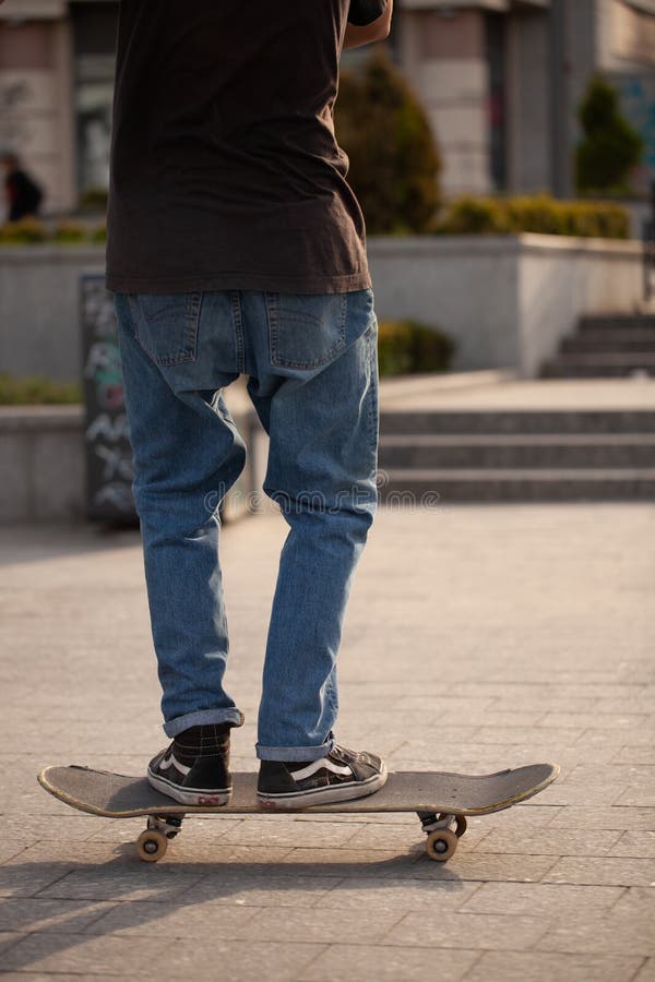 Young Guys in Stylish Clothes Ride a Skateboard Editorial Photography