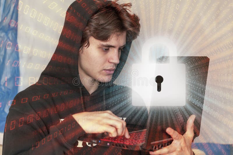 A young hacker uses a computer to organize massive attacks to break into corporate servers stock photo