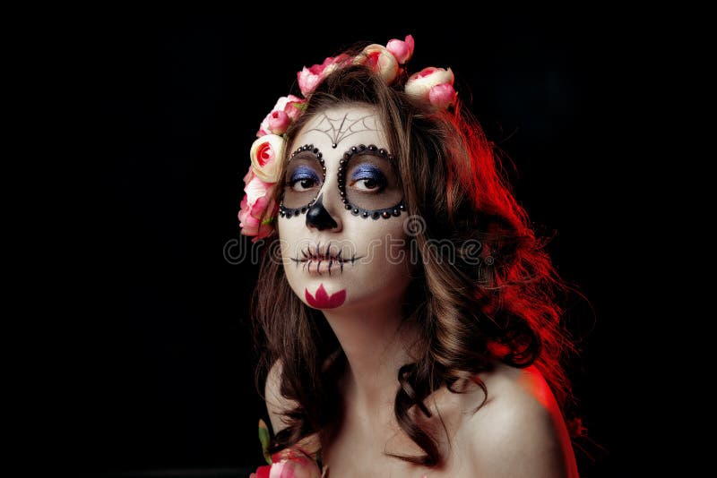 Young half-naked girl in a wreath of flowers. Girl skeleton. Sugar skull of dead bride stock images Young half-naked girl in a wreath of flowers. Girl skeleton. Sugar skull of dead bride stock images