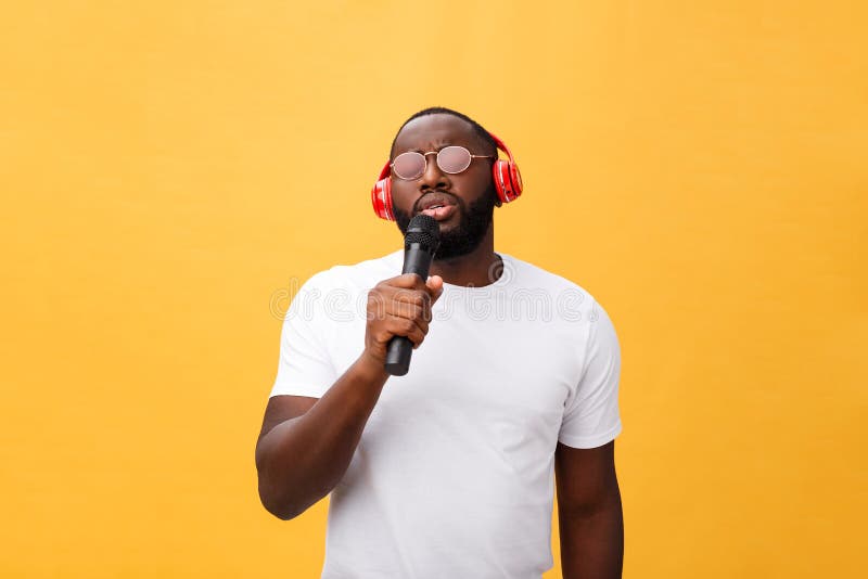 Young Handsome African American Boy Singing Emotional with Micro Stock