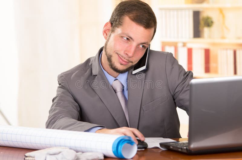 Young handsome architect working in an office stock photography Young handsome architect working in an office stock photography