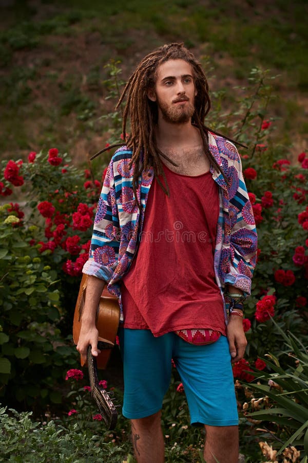Young Handsome Bearded Man Hippie with Dreadlocks with His Guitar ...