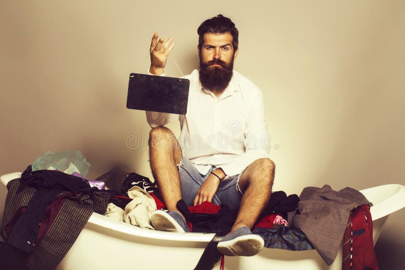 Bearded man on bath with wooden board