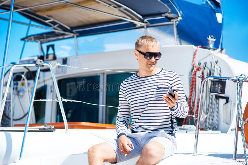 Young and handsome blond man talking on a mobile phone