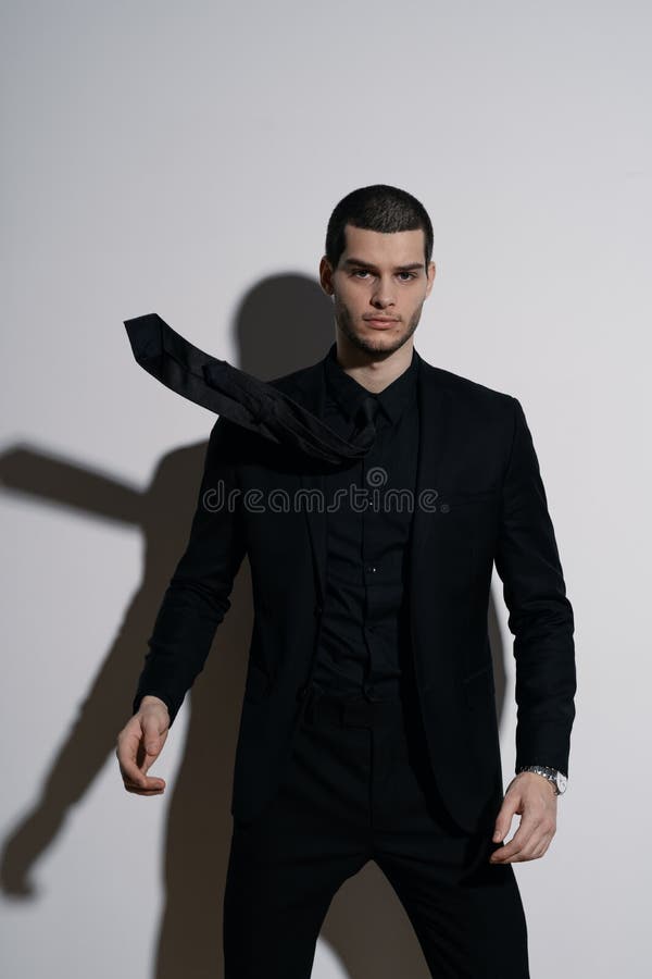 Young Handsome Businessman in Black Shirt and Black Suit Stock Photo ...