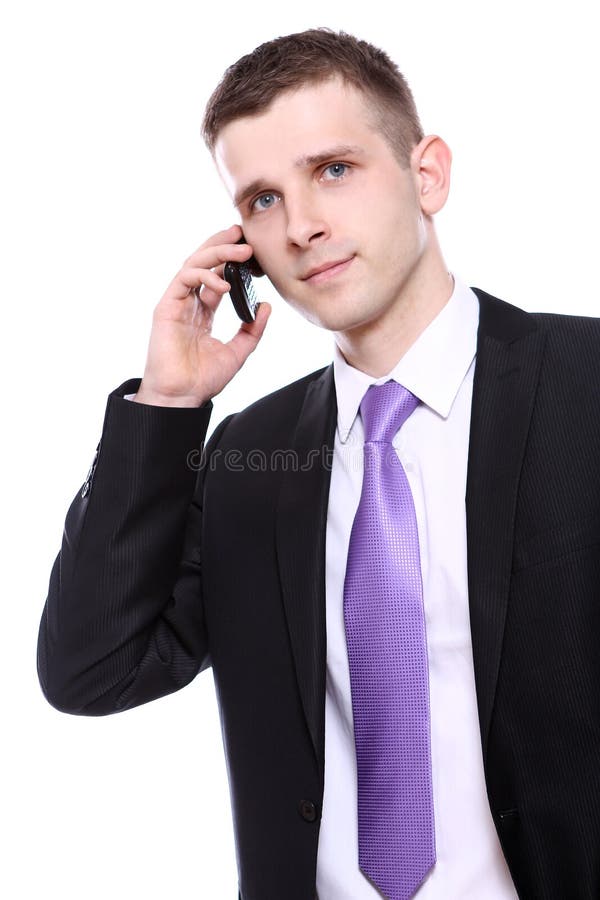 Young and handsome businessman using cellphone