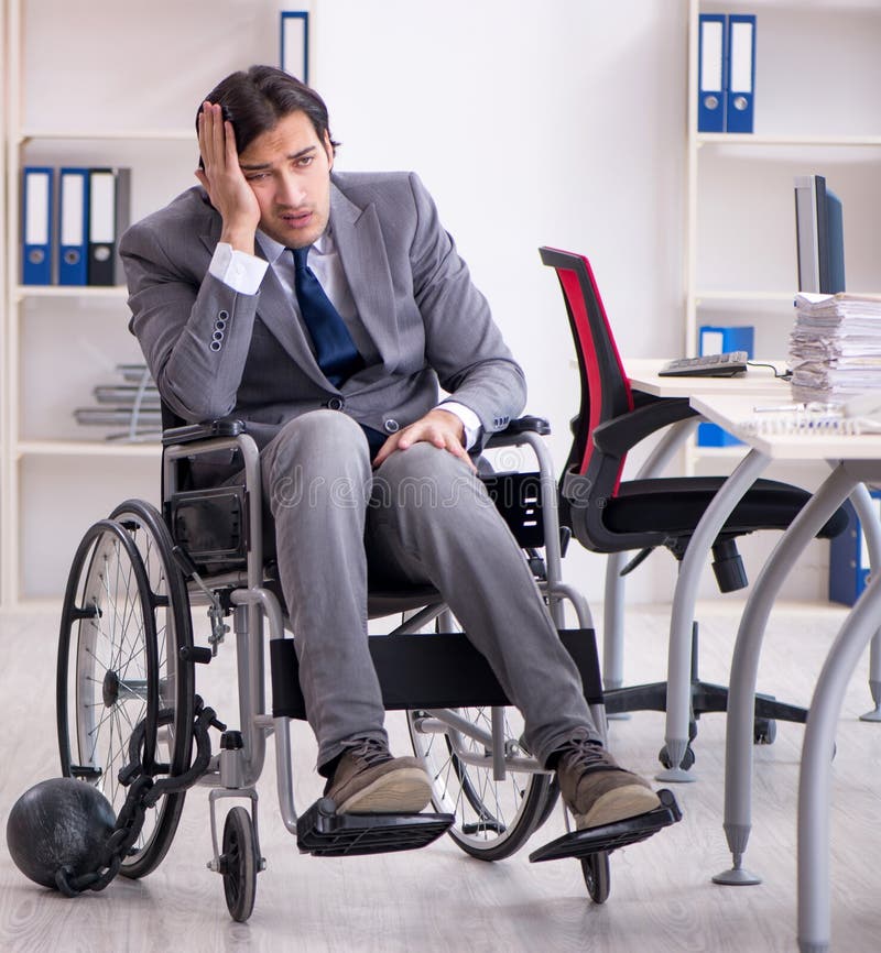 Young Handsome Employee in Wheelchair Working in the Office Stock Image