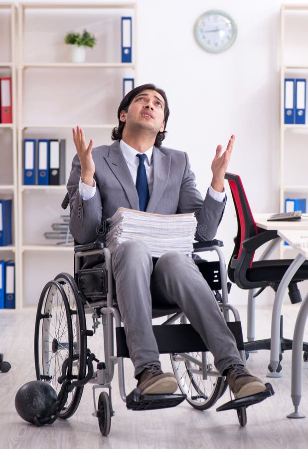 Young Handsome Employee in Wheelchair Working in the Office Stock Image