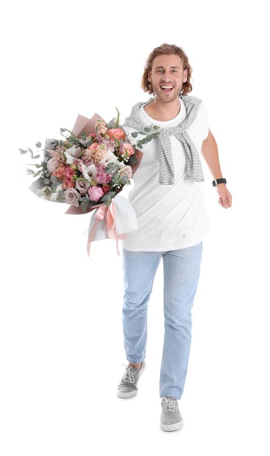 Young handsome man with beautiful flower bouquet on background