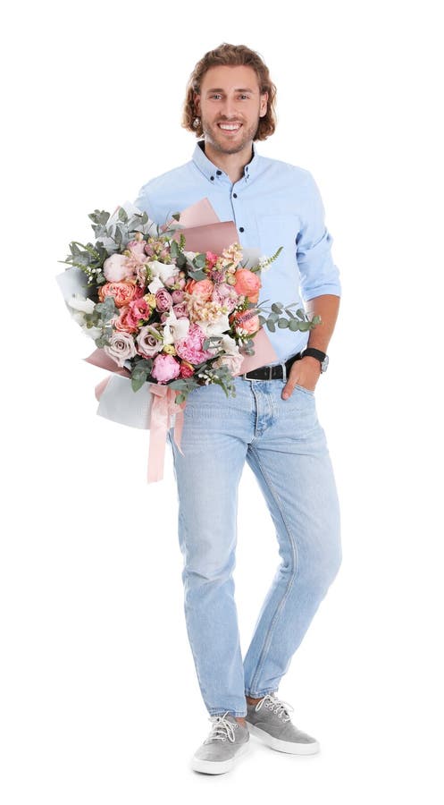 Young handsome man with beautiful flower bouquet on white