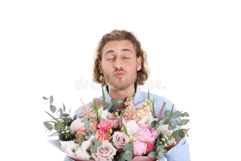 Young handsome man with beautiful flower bouquet on white