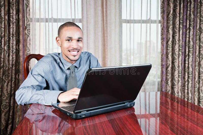 Young Handsome Man at Computer royalty free stock images