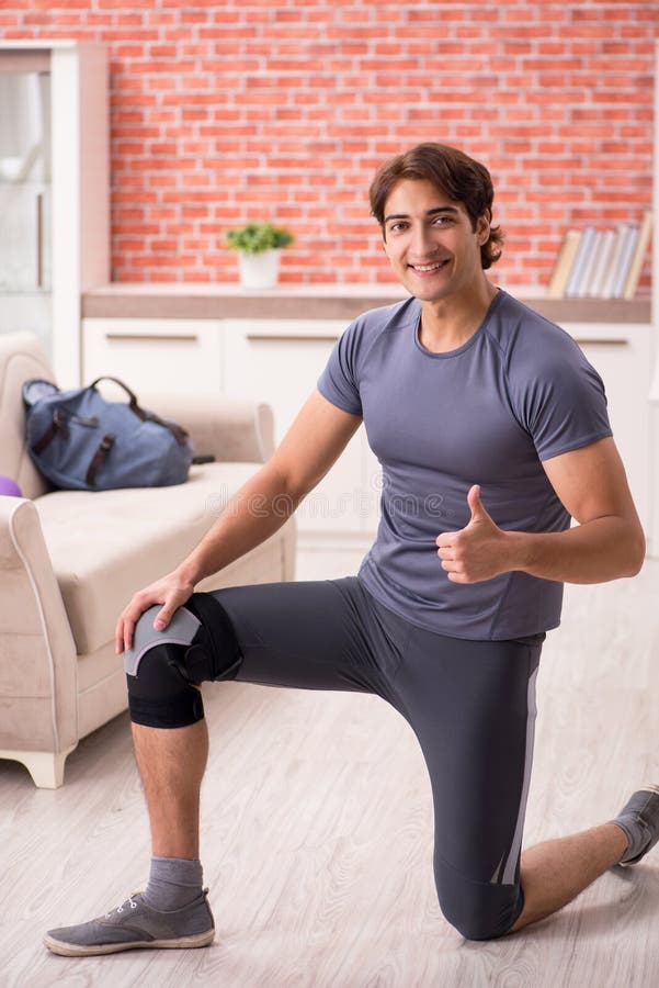 The Young Handsome Man Doing Sport Exercises at Home Stock Image ...