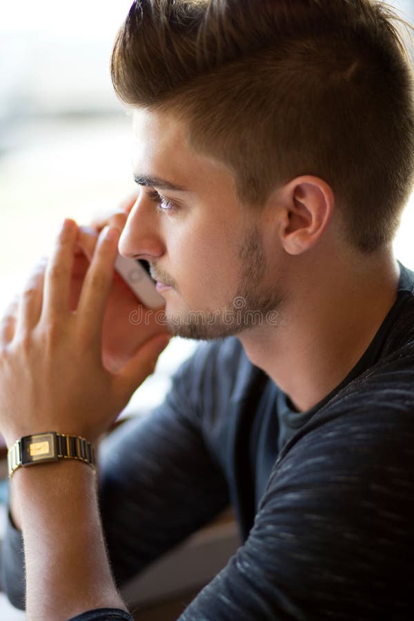 Young Handsome Man Sitting Near Window at Street Cafe with Pensive  Expression. Stock Image - Image of alone, park: 191209409