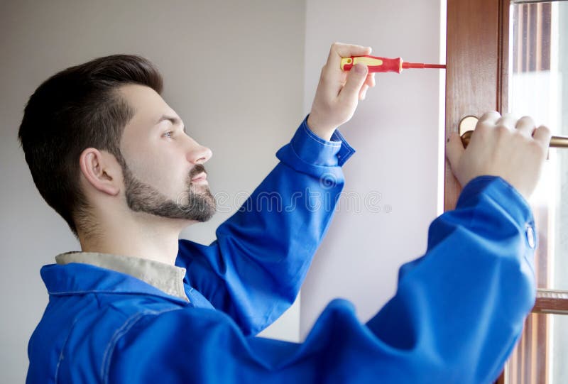 Young Handyman Repair Window with Screwdriver Stock Image Image of