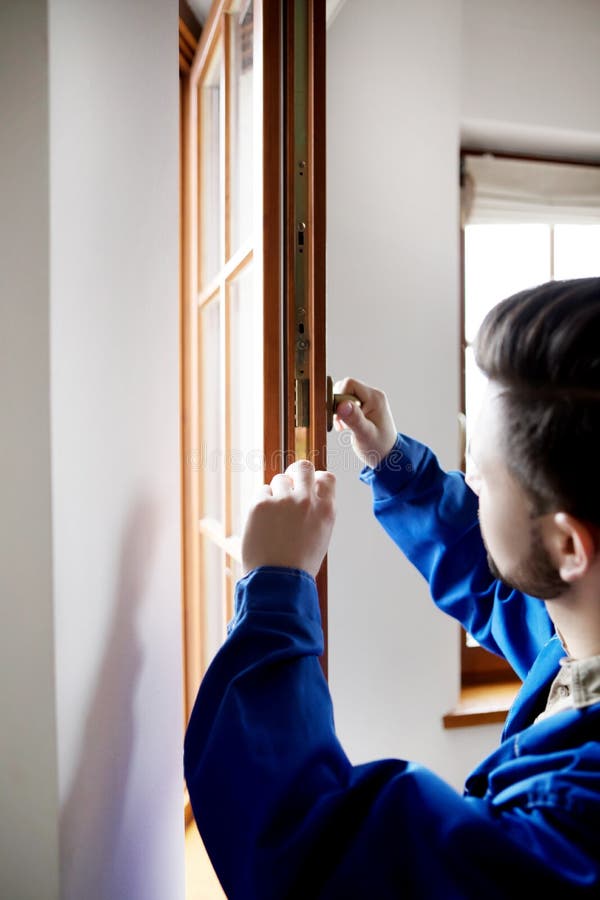 Young Handyman Repair Window with Screwdriver Stock Photo Image of