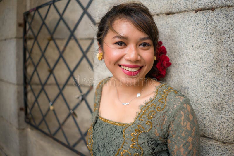 Young Happy And Beautiful Asian Woman Wearing Traditional Balinese